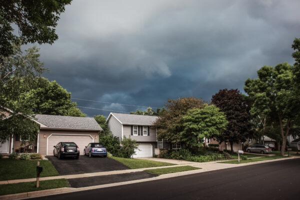 Storm clouds over homes in suburban neighborhood